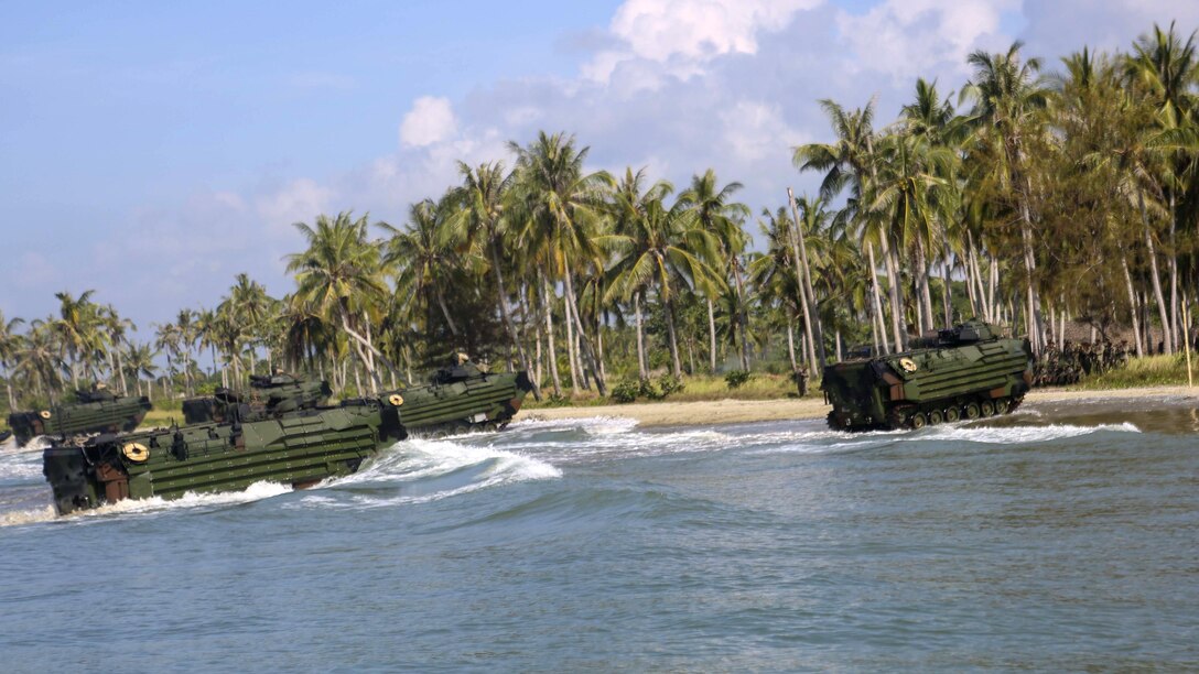 U.S. Marines assigned to Echo Company, Battalion Landing Team, 2nd Battalion, 2nd Marine Regiment conduct an amphibious transition from ship to shore at Tanduo Beach, Malaysia, May 30, 2016. The Marines are embarked aboard the USS Ashland (LSD 48) in support of exercise Cooperation Afloat Readiness and Training. CARAT is a series of annual, bilateral maritime exercises between the U.S. Navy, U.S. Marine Corps and the armed forces of nine partner nations to include Bangladesh, Brunei, Cambodia, Indonesia, Malaysia, Singapore, the Philippines, Thailand and Timor-Leste.The Ashland is assigned to U.S. 7th Fleet. 