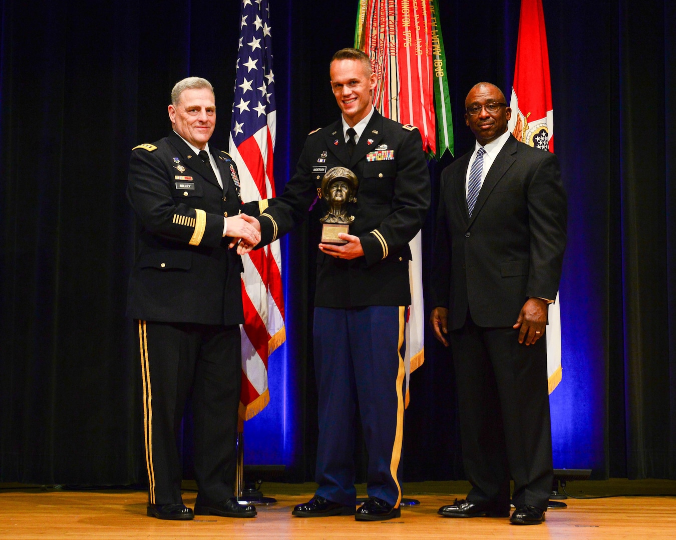 Chief Warrant Officer 2 Ryan Anderson of the California National Guard receives the prestigious MacArthur Leadership Award from Chief of Staff of the Army Gen. Mark A. Milley and James Wofford of the Gen. MacArthur Foundation at the Pentagon on June 1. The award is presented annually to one National Guard warrant officer and 28 Army officers overall nationwide who exemplify the ideals for which Gen. Douglas MacArthur stood: duty, honor, country.