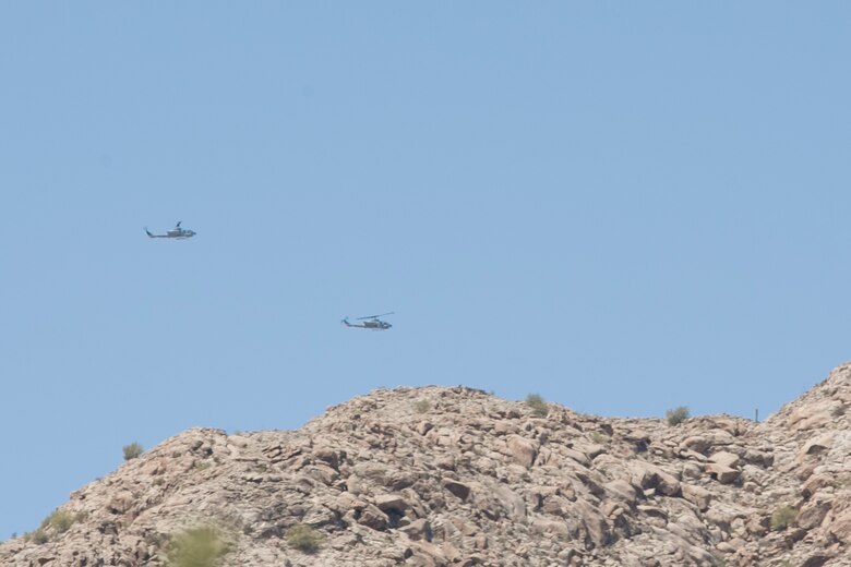 AH-1W ‘Super Cobras’ provide simulated air support as part of Integrated Training Exercise 3-16, held at the Combat Ville training area aboard Marine Corps Air Station Yuma, Ariz., May 29, 2016. (Official Marine Corps photo by Cpl. Thomas Mudd/Released)
