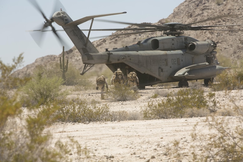Scout snipers with 2nd Battalion, 8th Marine Regiment, board a CH-53 ‘Super Stallion’ for extraction from the Combat Ville training area aboard Marine Corps Air Station Yuma, Ariz., during Integrated Training Exercise 3-16, May 29, 2016. (Official Marine Corps photo by Cpl. Thomas Mudd/Released)