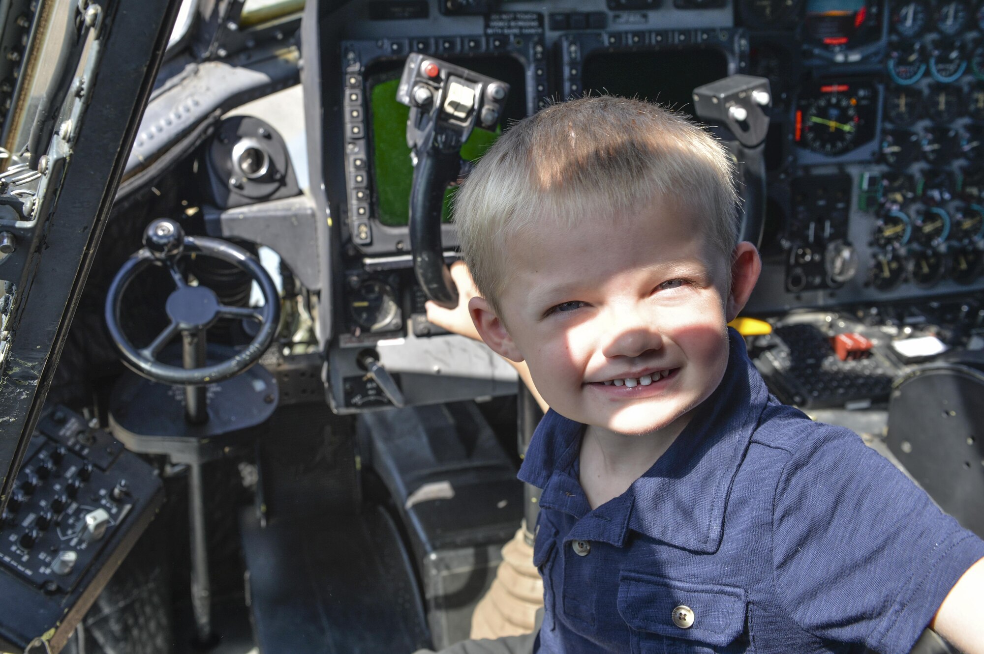 Four-year-old Carson Lester poses for a picture in the cockpit of an MC-130H Combat Talon II during his visit to the 15th Special Operations Squadron, Hurlburt Field, Fla., May 26, 2016. Lester is the star of a photograph taken during a family-photo session that was ‘photobombed’ by a Talon II and was invited to the 15th SOS to get an up-close look at the aircraft.