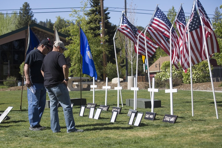 Ceremony attendees pay their respects to fallen service members during the Memorial Day Ceremony in Veteran’s Park at Big Bear Lake, Calif., May 30, 2016. Sgt. Maj. Michael J. Hendges, Combat Center Sergeant Major, represented the Combat Center as the guest speaker in the Memorial Day Ceremony spoke about the importance of remembering the ultimate sacrifice many American service members have paid. (Official Marine Corps photo by Cpl. Medina Ayala-Lo/Released)