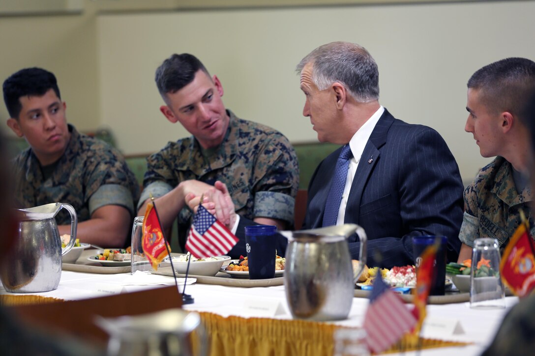Sen. Thom Tillis, right, greets the Marines sharing a meal with him at the mess hall during a visit at Marine Corps Air Station Cherry Point, N.C., June 1, 2016. Tillis visited the air station to address the needs and priorities of the base, and assess the Marine Corps’ presence in North Carolina. Tillis also toured Fleet Readiness Center East. Tillis is a North Carolina senator. (U.S. Marine Corps photo by Lance Cpl. Mackenzie Gibson/Released)