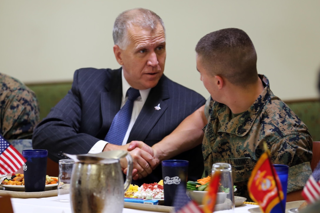 Sen. Thom Tillis, left, greets a Marine while sharing a meal at the mess hall during a visit at Marine Corps Air Station Cherry Point, N.C., June 1, 2016. Tillis visited the air station to address the needs and priorities of the base, and assess the Marine Corps’ presence in North Carolina. Tillis also toured Fleet Readiness Center East. Tillis is a North Carolina senator. (U.S. Marine Corps photo by Lance Cpl. Mackenzie Gibson/Released)