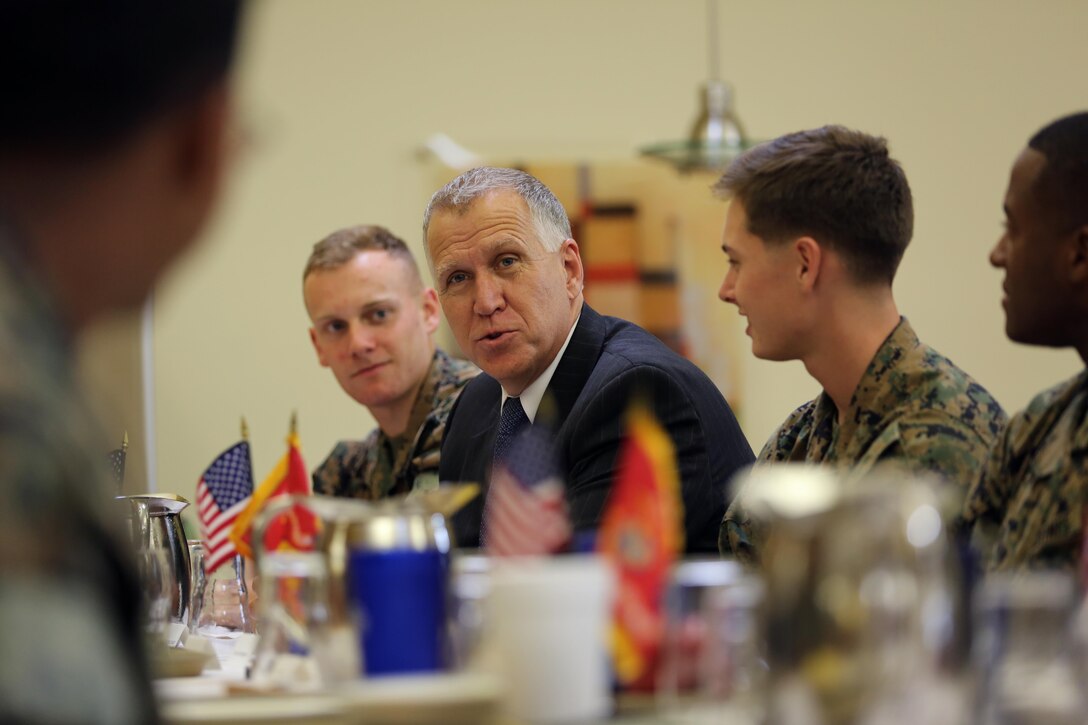 Sen. Thom Tillis speaks to Marines while sharing a meal at the mess hall during a visit at Marine Corps Air Station Cherry Point, N.C., June 1, 2016. Tillis visited the air station to address the needs and priorities of the base, and assess the Marine Corps’ presence in North Carolina. Tillis also toured Fleet Readiness Center East. Tillis is a North Carolina senator. (U.S. Marine Corps photo by Lance Cpl. Mackenzie Gibson/Released)