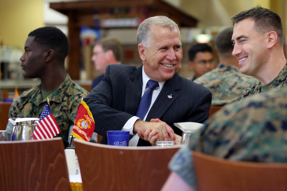 Sen. Thom Tillis, left, meets a Marine while sharing a meal at the mess hall during a visit at Marine Corps Air Station Cherry Point, N.C., June 1, 2016. Tillis visited the air station to address the needs and priorities of the base, and assess the Marine Corps’ presence in North Carolina. Tillis also toured Fleet Readiness Center East. Tillis is a North Carolina senator. (U.S. Marine Corps photo by Lance Cpl. Mackenzie Gibson/Released)