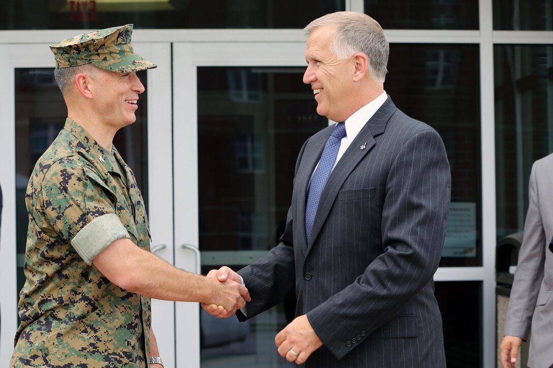 Col. Chris Pappas III, left, shakes hands with Sen. Thom Tillis at the mess hall during a visit at Marine Corps Air Station Cherry Point, N.C., June 1, 2016. Tillis visited the air station to address the needs and priorities of the base, and assess the Marine Corps’ presence in North Carolina. Tillis also toured Fleet Readiness Center East. Pappas is the commanding officer of MCAS Cherry Point, and Tillis is a North Carolina senator. (U.S. Marine Corps photo by Lance Cpl. Mackenzie Gibson/Released)