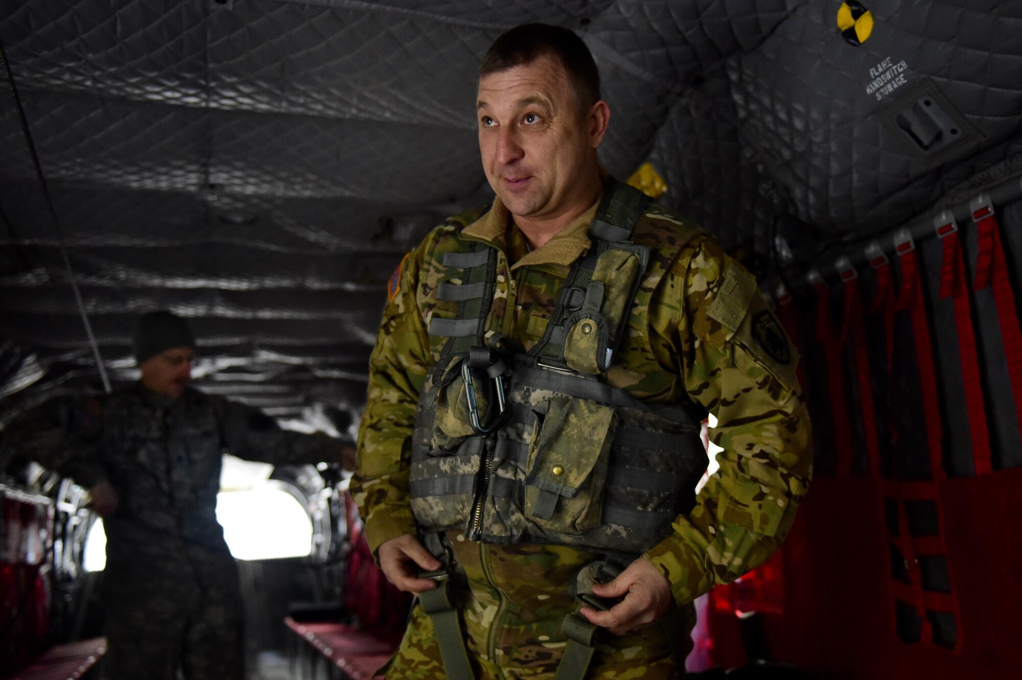 U.S. Army Chief Warrant Officer 4 Ronald Trani, Bravo Company 2-135th General Support Aviation Battalion CH-47 Chinook senior instructor pilot, puts on a flight vest March 31, 2016, at the Army Aviation Support Facility on Buckley Air Force Base, Colo. Pilots must be prepared at all times during a flight and the pre-flight checks they perform includes ensure their personal gear is ready for flight. (U.S. Air Force photo by Airman 1st Class Gabrielle Spradling/Released)