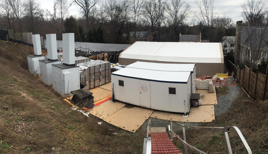 The Engineering Control Structure, the tan tent, and other aspects of the multi-layered approach to public safety the U.S. Army Corps of Engineers had in place during high probability operations at the 4825 Glenbrook Road cleanup effort are visible among the homes in the Spring Valley neighborhood in Washington, D.C., February 4, 2016. Public safety was the top priority at the site and with the multiple safety protocols in place, high probability operations searching for remnants of past military activity at the site resumed later that month.