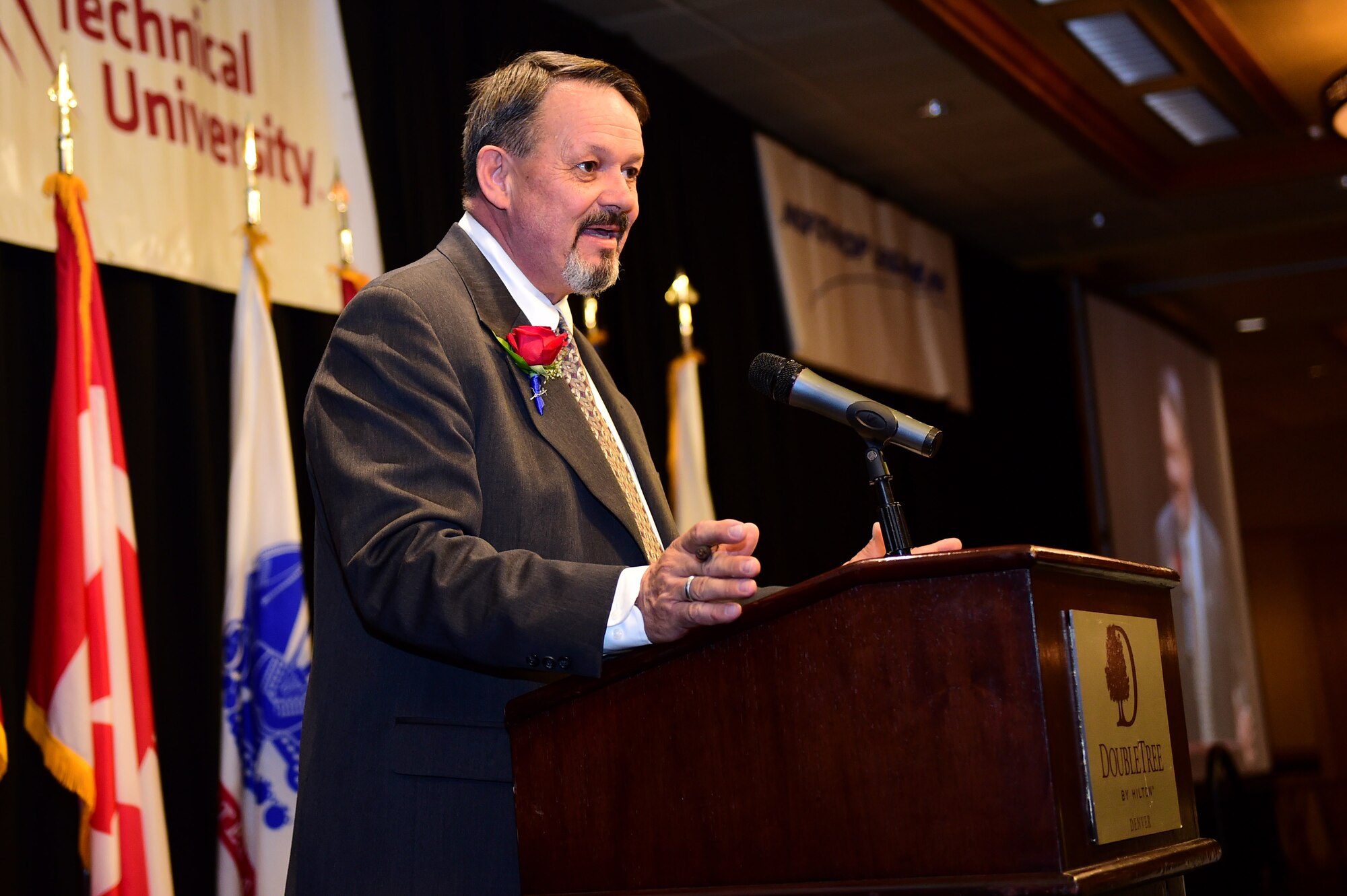 Rick Crandell, master of ceremonies, speaks May 13, 2016, during the Armed Forces Recognition Luncheon at the Doubletree Stapleton Hotel in Denver. The luncheon recognized outstanding Service members from all branches of service including active duty, guard and reserve components. (U.S. Air Force photo by Airman 1st Class Gabrielle Spradling/Released)