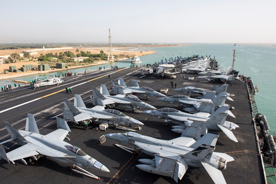 The aircraft carrier USS Harry S. Truman transits the Suez Canal, June 2, 2016. The Truman is supporting Operation Inherent Resolve, maritime security operations and theater security cooperation efforts in the U.S. 5th Fleet area of operations. Navy photo by Petty Offiicer 3rd Class Justin R. Pacheco