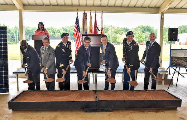 David Williams, Chip Marin, Maj. Gen. Ted Harrison, Bill Kelly, Richard Kidd, Col. Bill Marks and Michael McGhee symbolically break ground on Redstone Arsenal's solar project June 3.