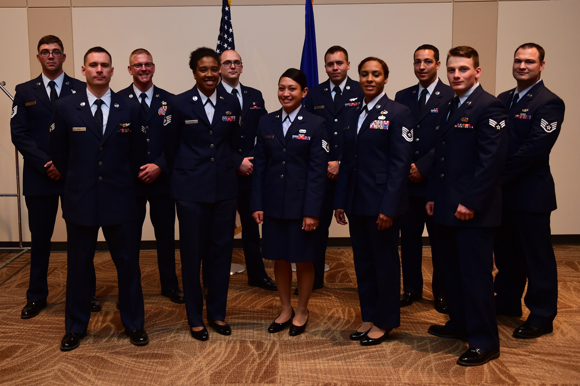 Newly promoted Airmen stand together May 31, 2016, after the May promotion ceremony at the Leadership Development Center on Buckley Air Force Base, Colo. Promotion ceremonies are a time-honored tradition in the Air Force, allowing co-workers, family and friends to support and congratulate Airmen on their new rank. (U.S. Air Force photo by Airman 1st Class Gabrielle Spradling/Released)