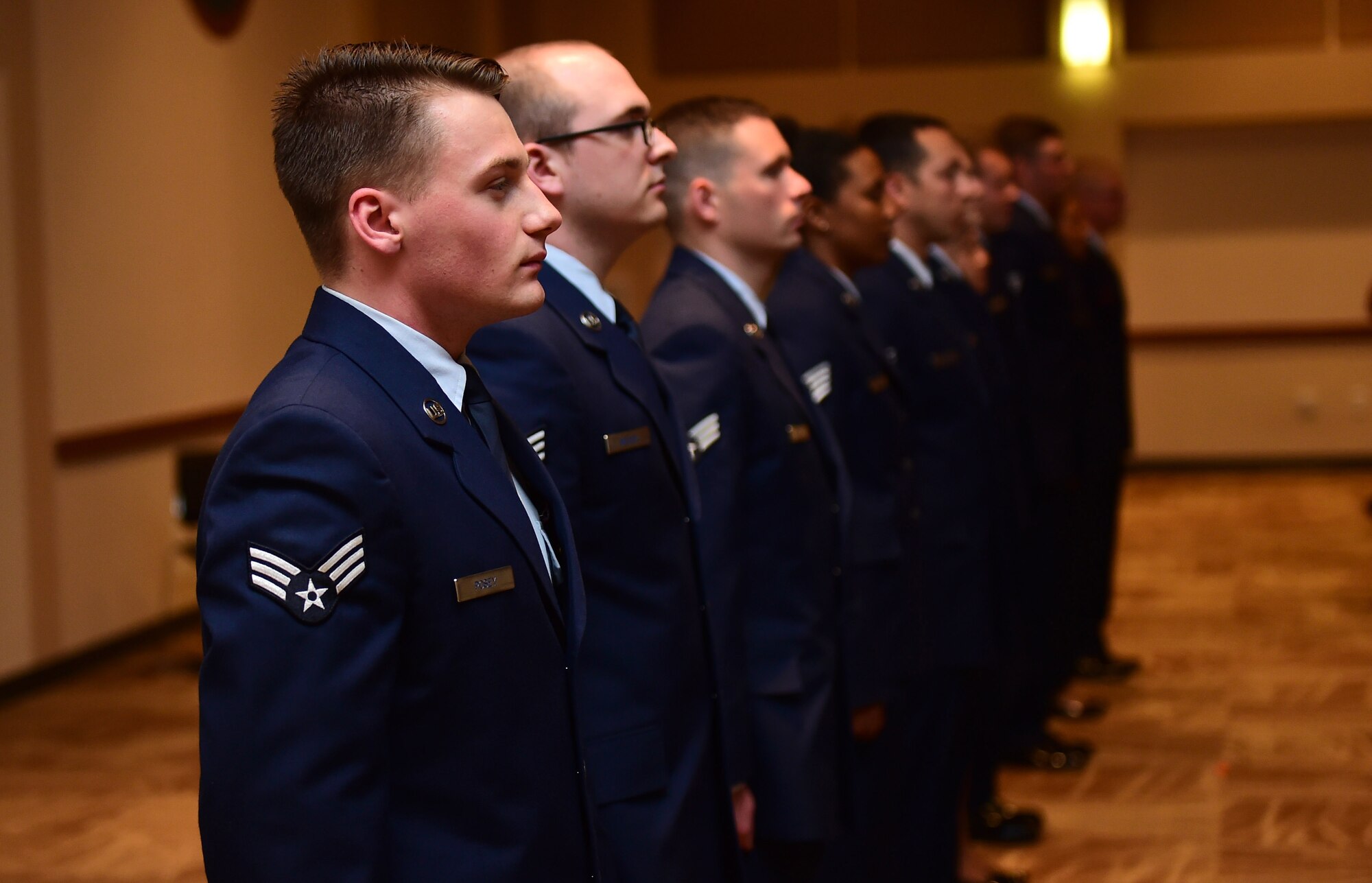 Newly promoted Airmen lead the audience in the Airmen’s Creed May 31, 2016, during the May promotion ceremony at the Leadership Development Center on Buckley Air Force Base, Colo. The Airmen’s Creed is a statement fueled by the Air Force’s heritage and warfighting ethos, which was introduced in April 2007. (U.S. Air Force photo by Airman 1st Class Gabrielle Spradling/Released)