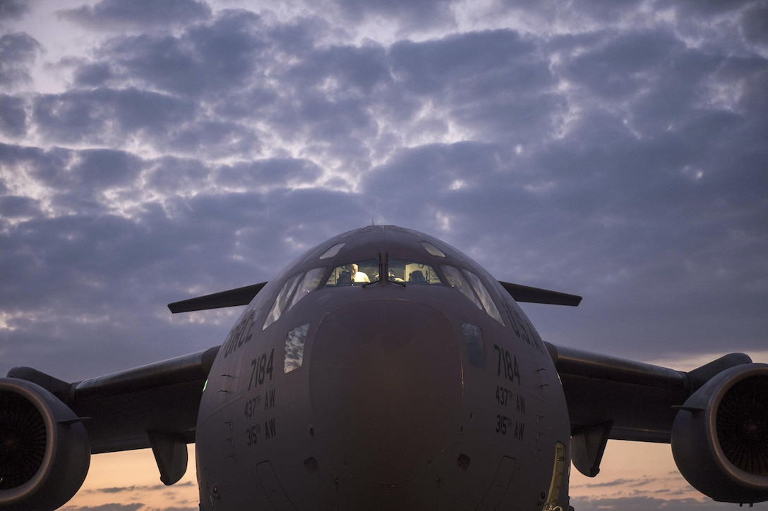 Airmen prepare a C-17 Globemaster III for an airdrop mission with soldiers assigned to the 82nd Airborne Division during exercise Crescent Reach 16 at Joint Base Charleston, S.C., May 26, 2016. The annual exercise evaluates the base's abilities in a large-scale aircraft formation while deploying airmen and cargo in response to a simulated crisis abroad. Air Force photo by Tech. Sgt. Jason Robertson
