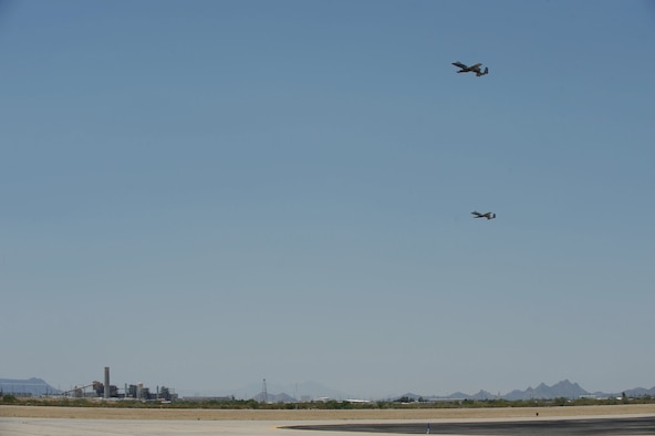 Two A-10C Thunderbolt IIs fly over the flight line during Hawgsmoke 2016 at Davis-Monthan Air Force Base, Ariz., June 1, 2016. D-M hosted the biennial competition which scores strafing accuracy, high-altitude dive-bombing, low-angle high-delivery, Maverick missile precision and team tactics. (U.S. Air Force photo by Airman 1st Class Ashley N. Steffen/Released)
