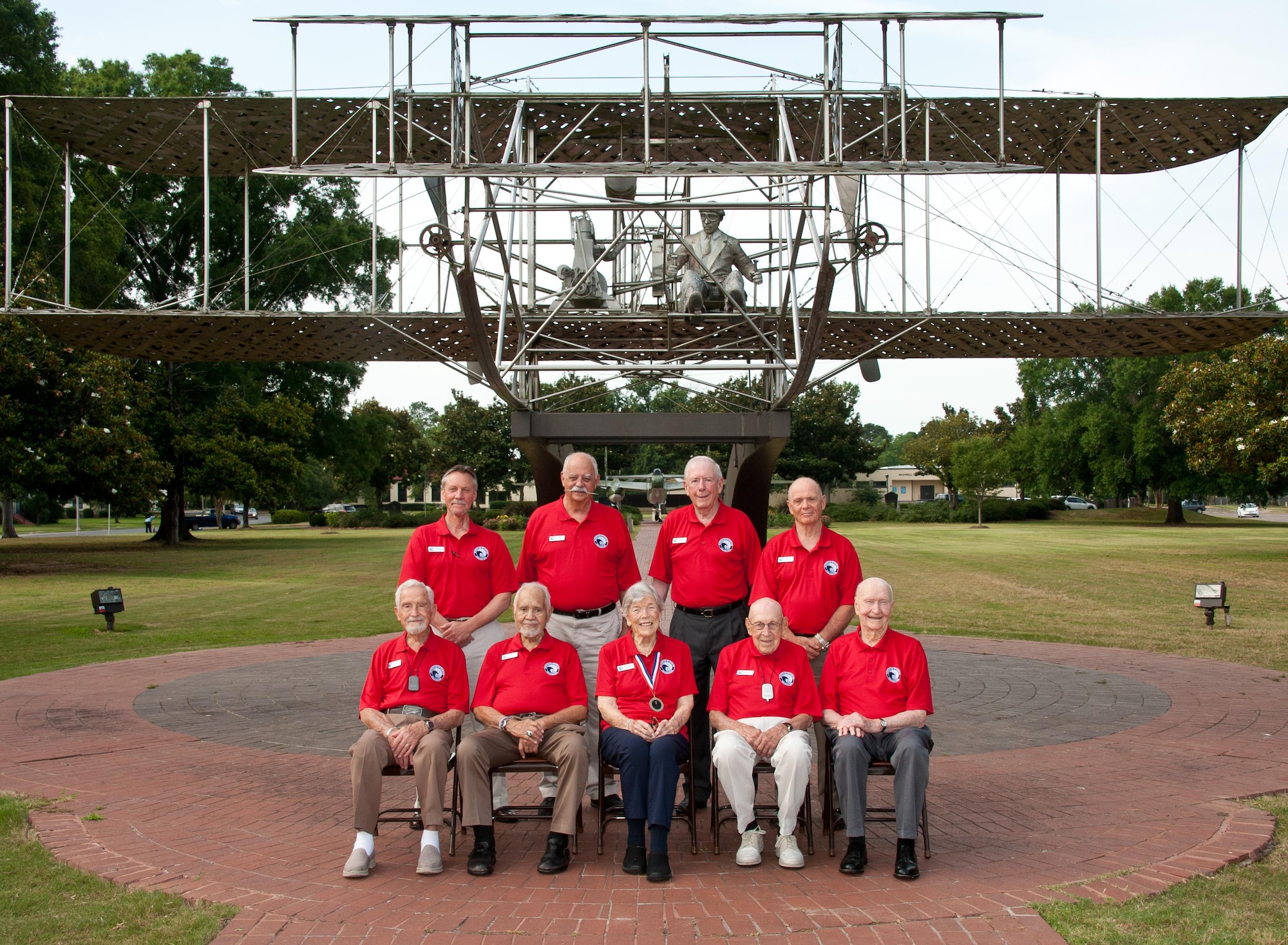 Aviation legends participating in Air Command and Staff College's 35th annual 2016 Gathering of Eagles event pose for a group photo in front of the Wright Flyer in Air Park, June 2, 2016. PIctured are (L-R) front row: Lieutenant General LeRoy J. Manor; Lieutenant Colonel Leo R. Gray; Dawn R.B. Seymour; Lieutenant Colonel Richard E. "Dick" Cole; Colonel Gail S. Halvorsen. Second Row: Master Sergeant Timothy A. Wilkinson; Colonel Gaillard "Evil" Peck, Jr.; General Charles G. "Chuck" Boyd; Brigadier General Amir Nachumi. GOE is a program that encourages the study of aviation history and emphasizes contributions of air and space pioneers.  (US Air Force photo by Melanie Rodgers Cox/Released)


