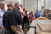 Members of the Honorary Commander program get a briefing during their tour of the 60th Maintenance Group's welding shop at Travis Air Force Base, Calif., May 20, 2016. (U.S. Air Force photo by Louis Briscese/Released)