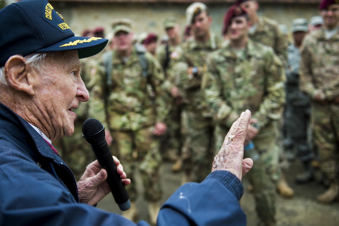 Jack Hamlin, a D-Day veteran from the Coast Guard, talks about his experience in World War II to U.S. service members in Angoville au Plain, France, June 1, 2016. Hamlin offered remembrances during a tour of the Battle of Carentan as part of marking the 72nd anniversary of the historic event. Navy photo by Petty Officer 1st Class Sean Spratt