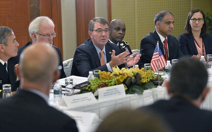 U.S. Secretary of Defense Ash Carter, foreground center, hosts a meeting with Australia Minister of Defense Kevin Andrews and Japan Minister of Defense Gen Nakatani at the Shangri-La Dialogue in Singapore, May 30, 2015. 