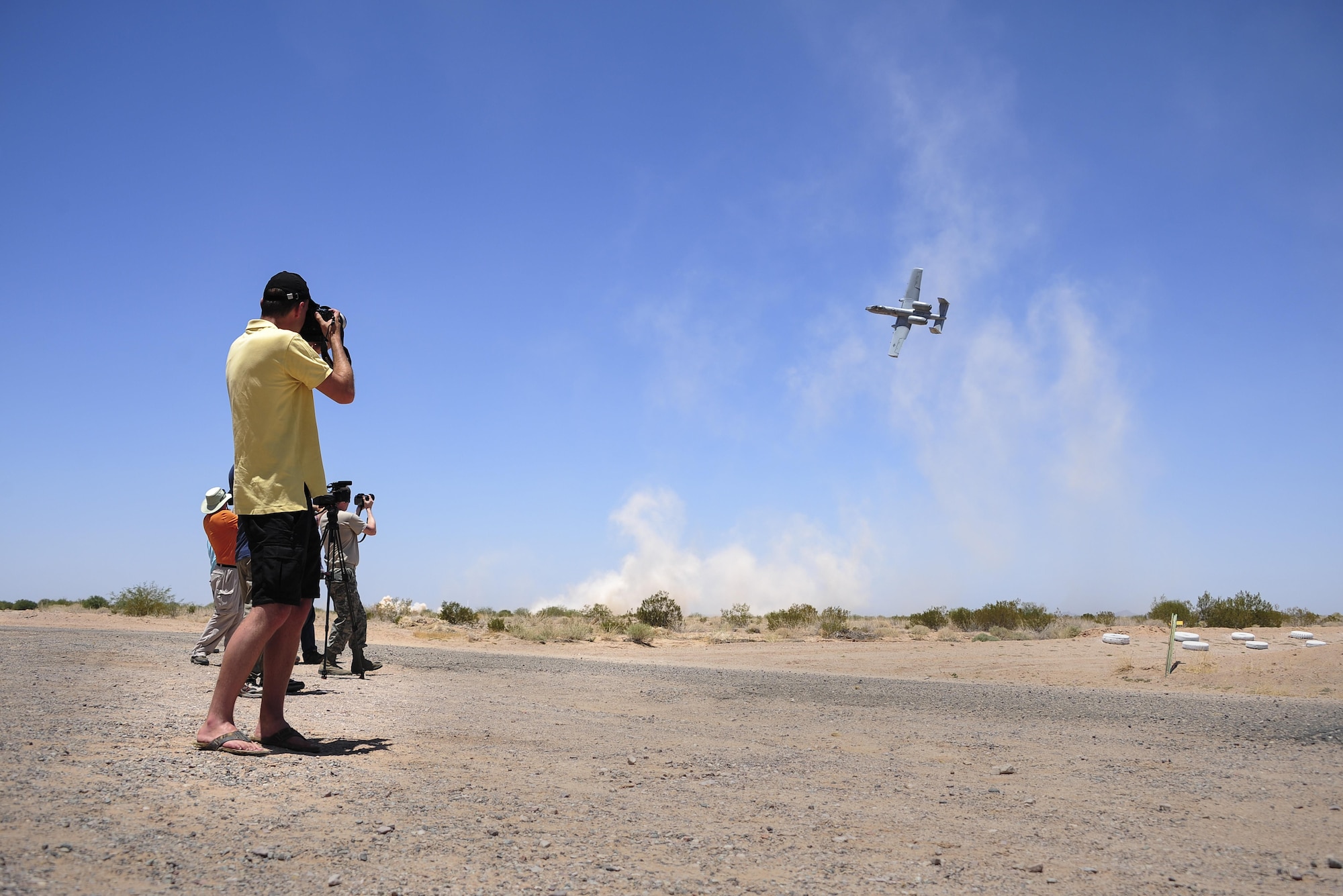 Members of local and international media photograph an A-10C Thunderbolt II during the 2016 Hawgsmoke competition at Barry M. Goldwater Range, Ariz., June 2, 2016. Thirteen A-10 units worldwide participated in this year’s competition. (U.S. Air Force photo by Senior Airman Chris Drzazgowski/Released)