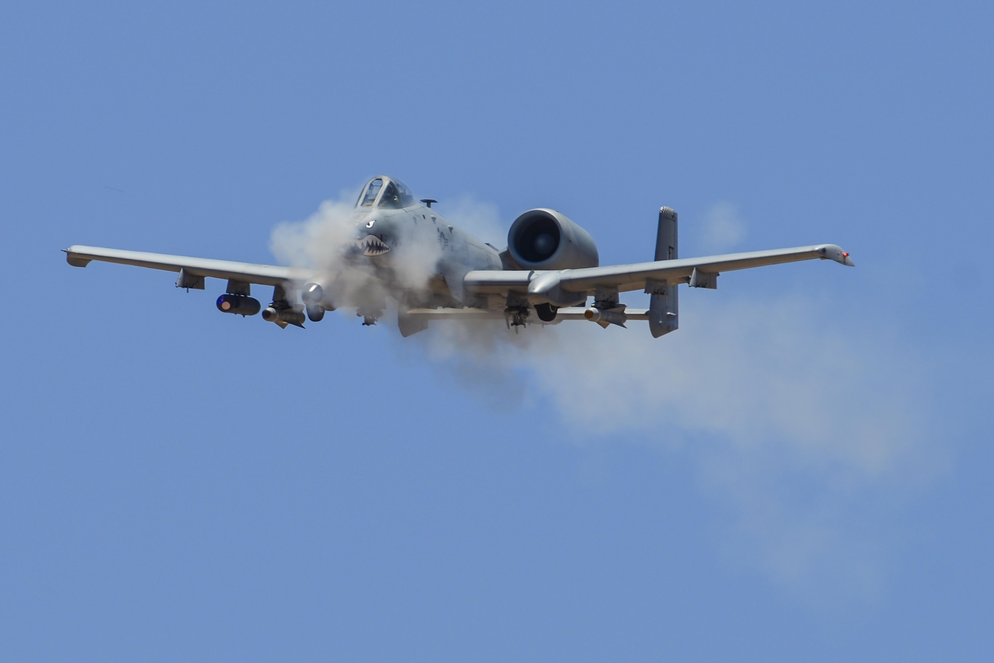 An A-10C Thunderbolt II assigned to the 23rd Fighter Group, Moody AFB, Ga., performs a low-angle strafe during the 2016 Hawgsmoke competition at Barry M. Goldwater Range, Ariz., June 2, 2016. Hawgsmoke is a biennial competition focused on tactics the A-10C can employ during combat operations. (U.S. Air Force photo by Senior Airman Chris Drzazgowski/Released)