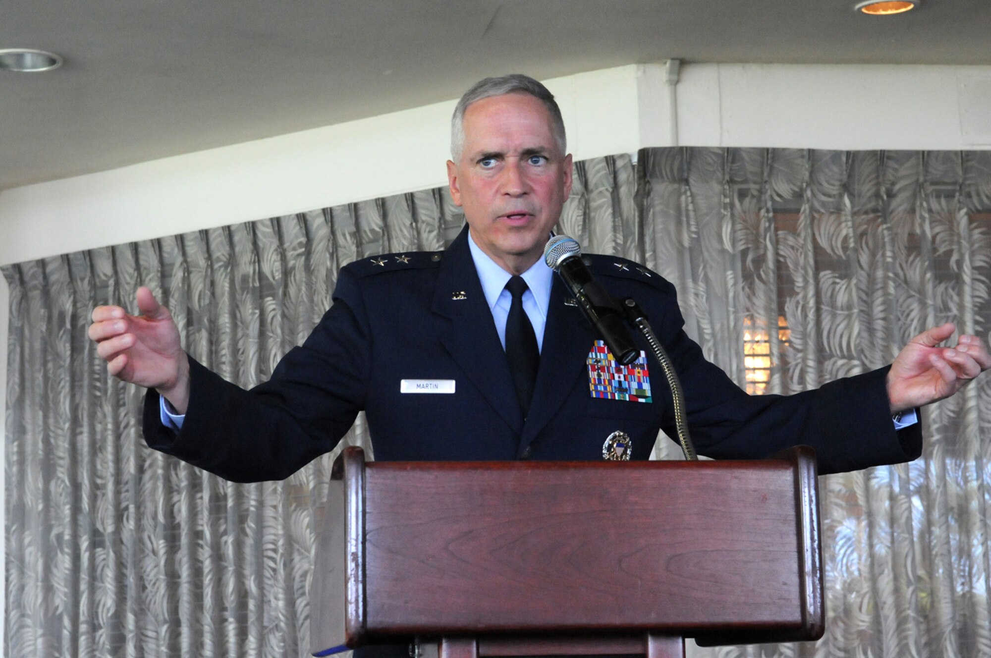 Maj. Gen. Frederick Martin, U.S. Air Force Expeditionary Center commander, makes opening remarks during the 515th Air Mobility Operations Wing change of command ceremony June 2, 2016, at Joint Base Pearl Harbor-Hickam, Hawaii. During the ceremony, Col. Casey Eaton relinquished command to Col. Scott Zippwald. (U.S. Air Force photo by David D. Underwood, Jr.)