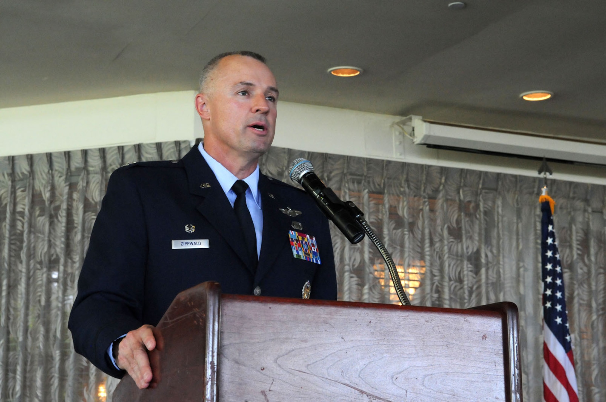 Col. Scott Zippwald, incoming 515th Air Mobility Operations Wing commander, speaks during the 515th AMOW change of command ceremony June 2, 2016, at Joint Base Pearl Harbor-Hickam, Hawaii. The 515 AMOW also serves as the forward air mobility liaison to United States Pacific Command, Pacific Air Forces, United States Forces-Korea, United States Forces-Japan, and Alaska Command for theater air mobility operations and capabilities. (U.S. Air Force photo by David D. Underwood, Jr.)