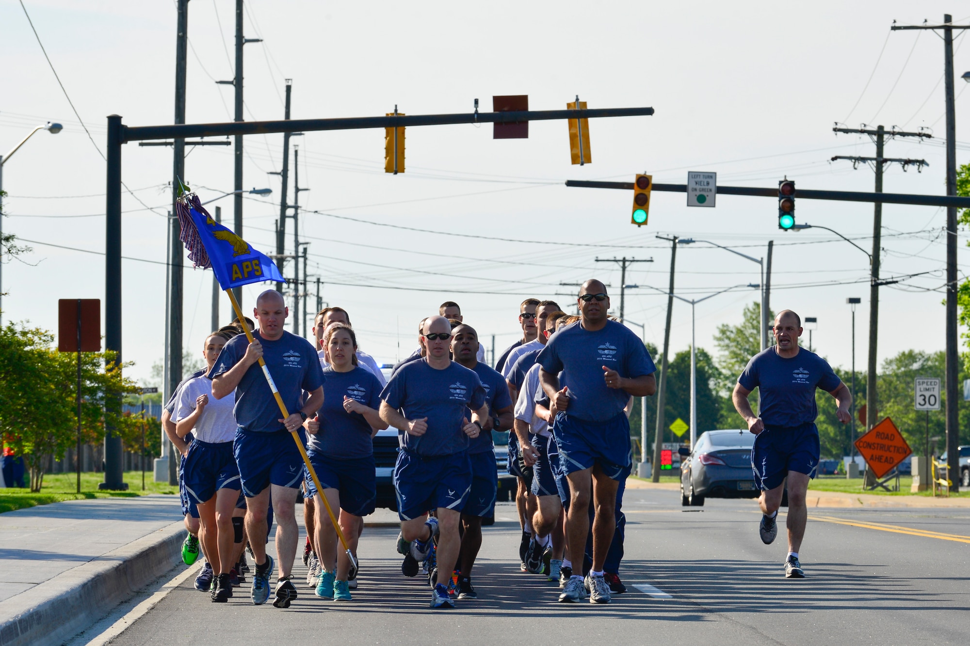 Airmen from the 436th Aerial Port Squadron run in formation during the Port Dawg Memorial Run kicking off the 436th APS 50th Anniversary Celebration May 20, 2016, at Dover Air Force Base, Del. The run memorialized fallen port dawgs from the 436th APS. (U.S. Air Force photo/Senior Airman William Johnson) 