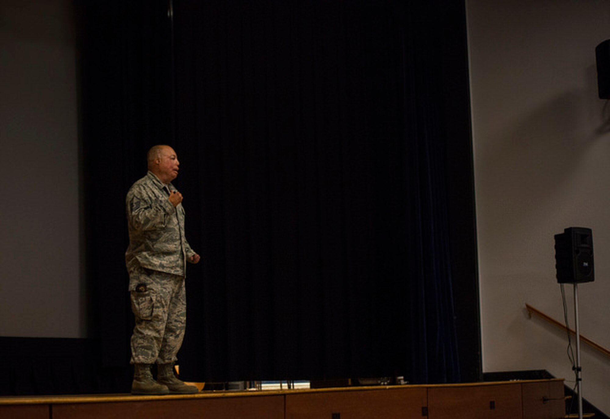 Master Sgt. Israel DT Del Toro shares his story during a professional development event at the base theater on Joint Base McGuire-Dix-Lakehurst, N.J. May 24. Del Toro was the first member of the Air Force to re-enlist with 100 percent disability. (U.S. Air Force photo by Senior Airman Joshua King)