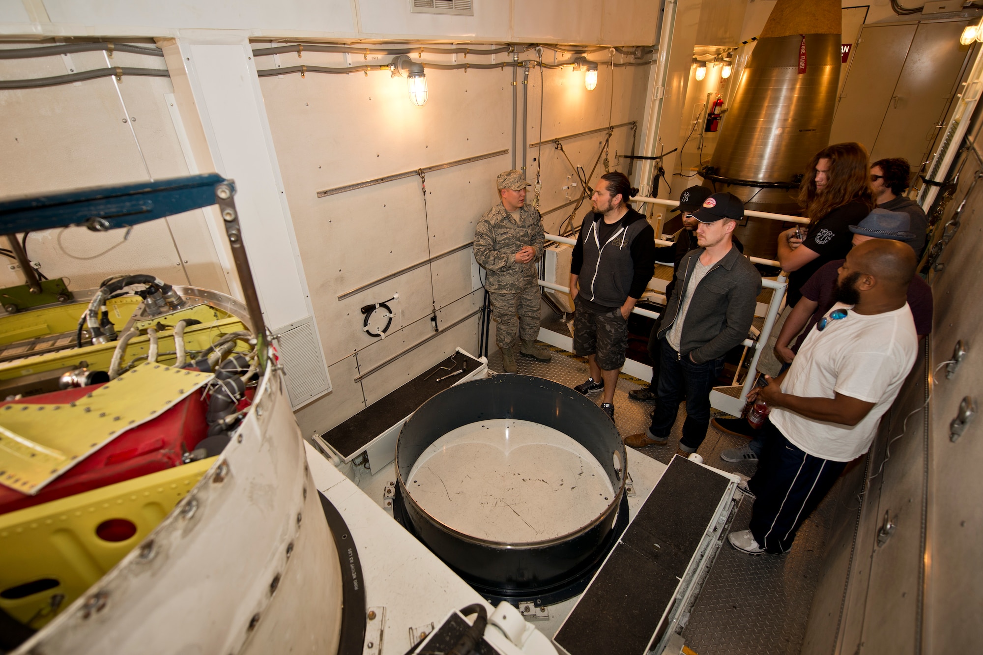 David Cook, the 2008 American Idol winner, and his band members tour Minot Air Force Base, N.D., May 31, 2016. The visit included touring a B-52 static display, the Weapons System Trainer and the Uniform 01 training facility. (U.S. Air Force photo/Airman 1st Class J.T. Armstrong)