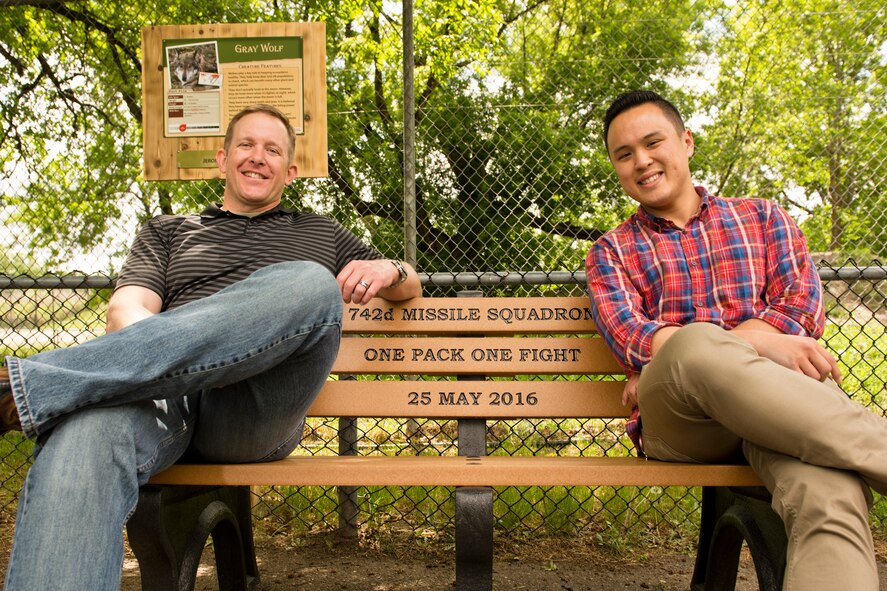 The 742nd Missile Squadron presented a custom engraved bench at the Roosevelt Park Zoo in Minot, N.D., May 26, 2016. The bench donated by the 742nd MS, aka The Wolf Pack, commemorates hundreds of volunteer hours and is appropriately positioned in front of the Grey Wolf exhibit. (U.S. Air Force photos/Airman 1st Class J.T. Armstrong)