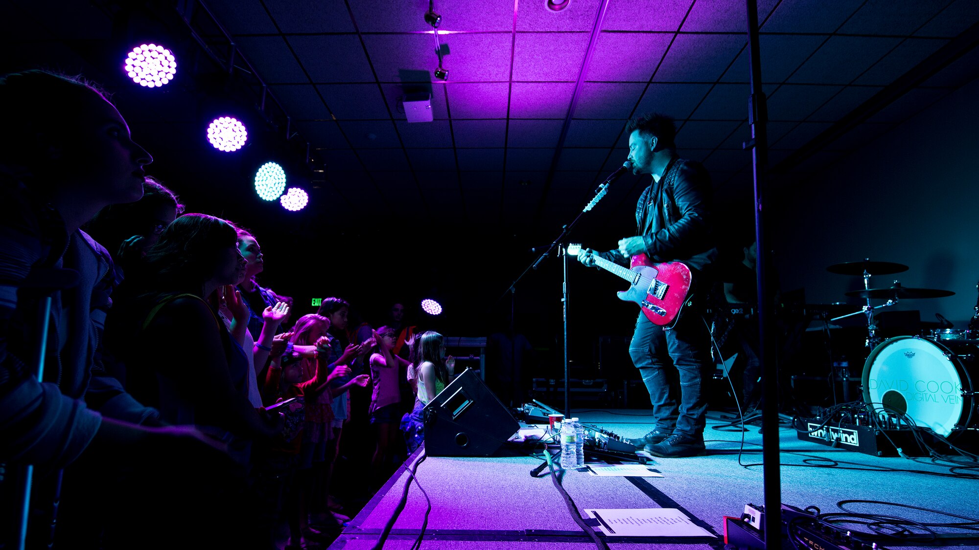 David Cook and his band perform for military members and their families at Minot Air Force Base, N.D., May 30, 2016. The 2008 American Idol winner performed tracks from his most recent album and popular songs by Michael Jackson and Led Zeppelin. (U.S. Air Force photo/Airman 1st Class J.T. Armstrong)