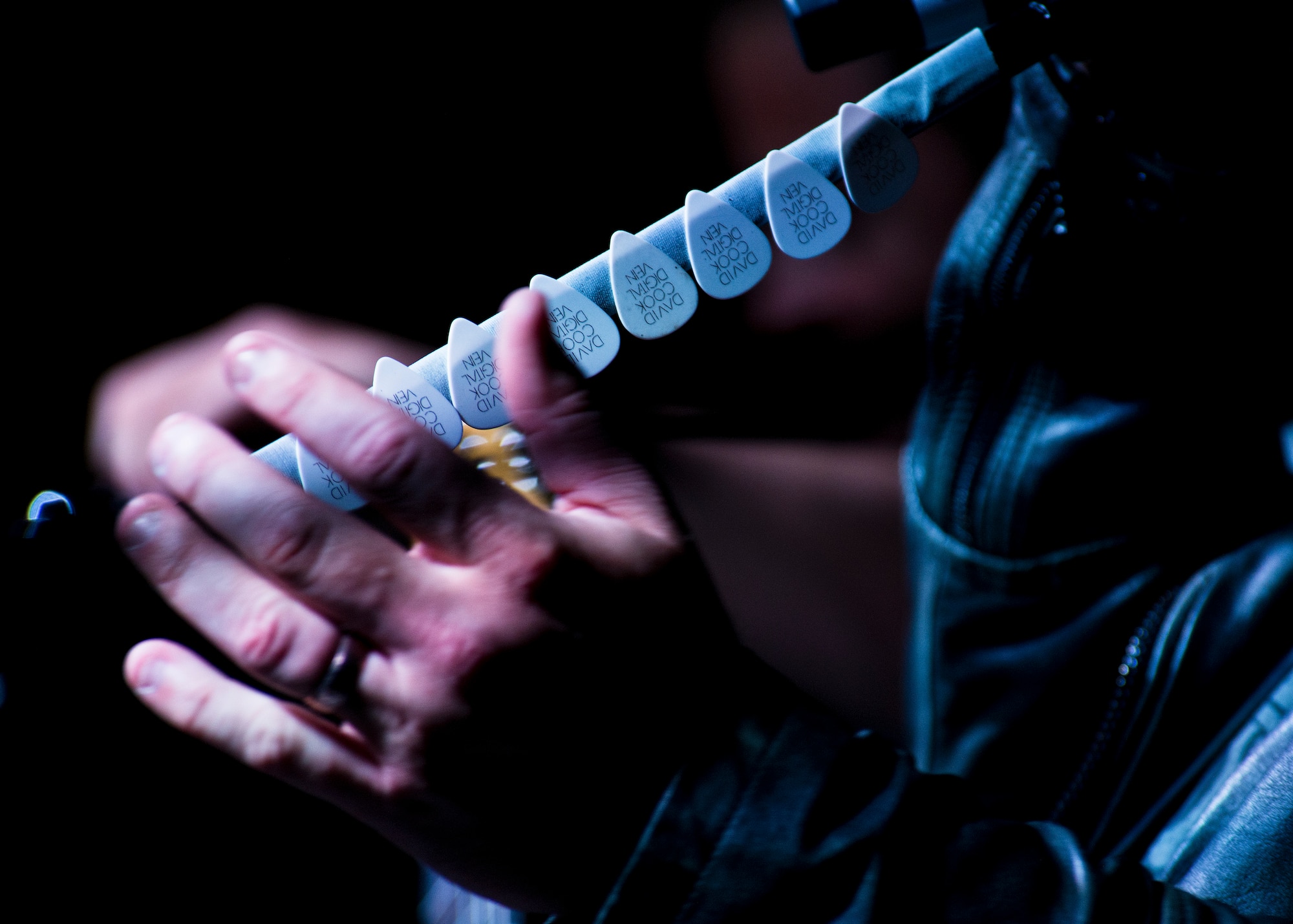 David Cook’s guitar picks line his microphone stand during his performance for military members and their families at Minot Air Force Base, N.D., May 30, 2016. Cook and his band performed on Memorial Day in honor of fallen service members. (U.S. Air Force photo/Airman 1st Class J.T. Armstrong)