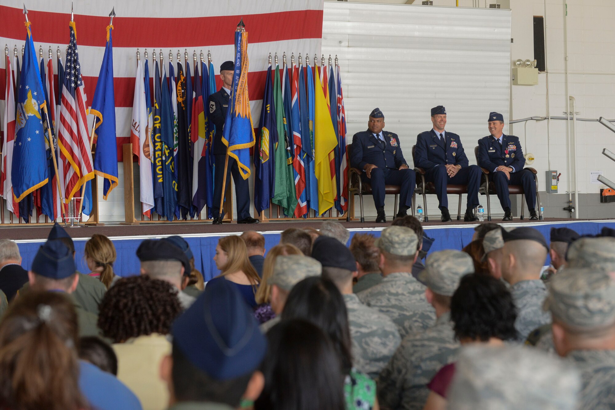 The official party listens to the narrator during the 5th Bomb Wing change of command ceremony at Minot Air Force Base, N.D., June 3, 2016. Col. Matthew Brooks replaced Col. Jason Armagost as the 54th commander and recently served as the vice wing commander at Whiteman Air Force Base, Mo. (U.S. Air Force photo/Airman 1st Class Jessica Weissman)