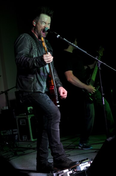 David Cook and his band perform at the Jimmy Doolittle Center at Minot Air Force Base, N.D., May 30, 2016.  Cook is an American Idol winner and performed as part of his spring military base tour. (U.S. Air Force photo by Staff Sgt. Chad Trujillo)