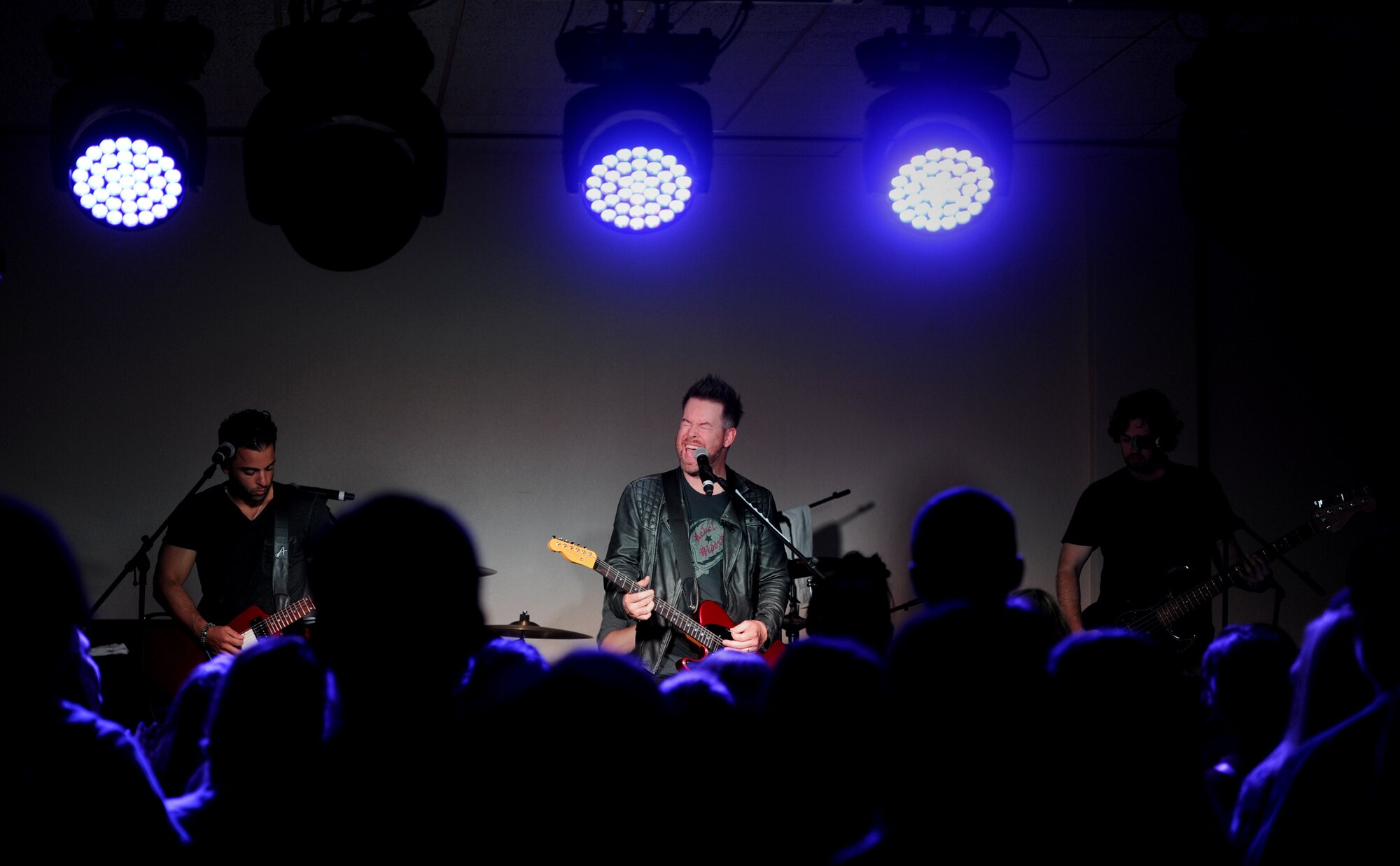 David Cook and his band perform at the Jimmy Doolittle Center at Minot Air Force Base, N.D., May 30, 2016.  Cook is an American Idol winner and performed as part of his spring military base tour. (U.S. Air Force photo by Staff Sgt. Chad Trujillo)