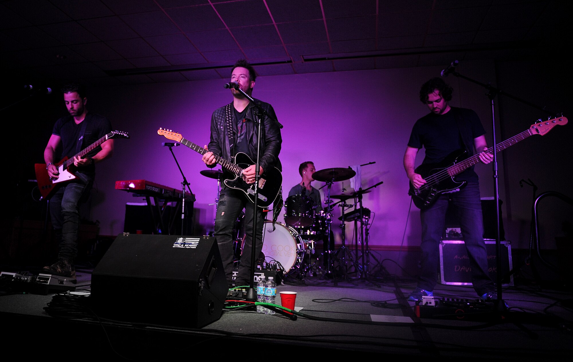 David Cook and his band perform at the Jimmy Doolittle Center at Minot Air Force Base, N.D., May 30, 2016.  Cook is an American Idol winner and performed as part of his spring military base tour. (U.S. Air Force photo by Staff Sgt. Chad Trujillo)