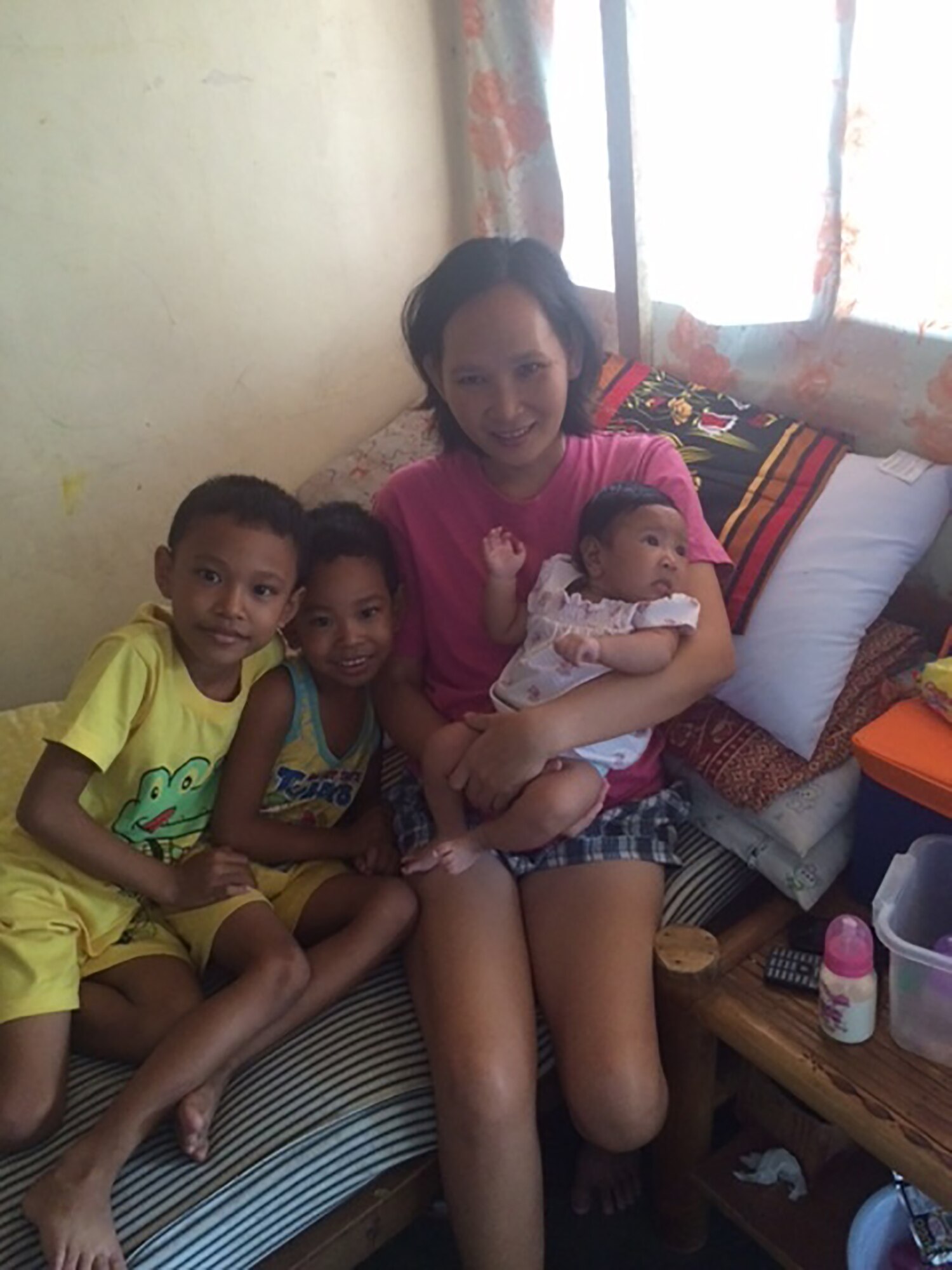 Mrs. Ariola poses with her three children April 14, 2016 in the Philippines. Daniel Staicer, a US Army Alaska facility operations specialist recently deployed to the Philippines and donated blood to Mrs. Ariola for an emergency blood transfusion when the local blood bank was out of her blood type. (Courtesy Photo)