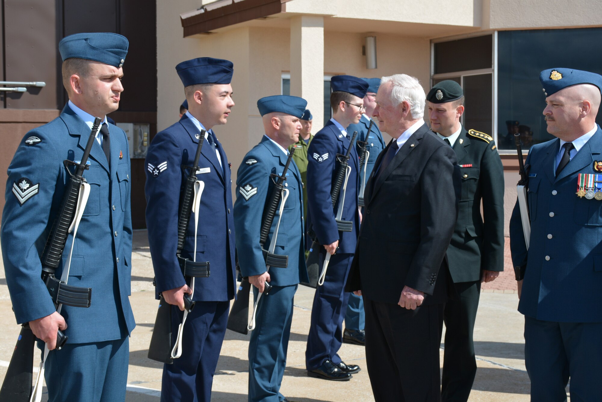 The Governor General and Commander-in-Chief of Canada, His Excellency the Right Honorable David Johnston, looks over a formation of U.S. and Candien Airmen and Soldiers as part of a special Review of Troops shortly after his arrival to Tinker Air Force Base, on May 28.  His Excellency visited the base as part of a working visit to five states to discuss and promote innovation, education, trade and philanthropy. ( Air Force photo by Darren D. Heusel/Released)