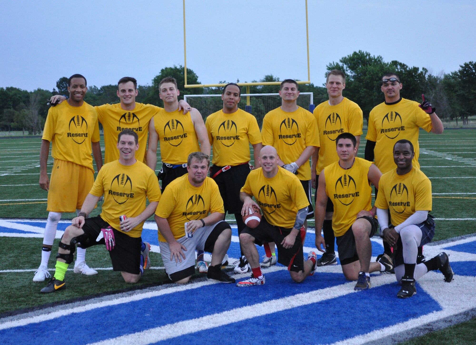 Reserve Gold players lined up on the 50-yard line after winning the 2016 Spring Flag Football League championship May 24. Top row, from left, Reggie Davis, Ryan Clary, Brett Nims, Gregory Shepherd, Michael Rosenthal, Evan Way and Ryan Barnes. On a knee are Sean Doll, Adam Hawkins, Jeffrey Inferrere, Jacob Bacon and Juston Curry. (Courtesy photo)