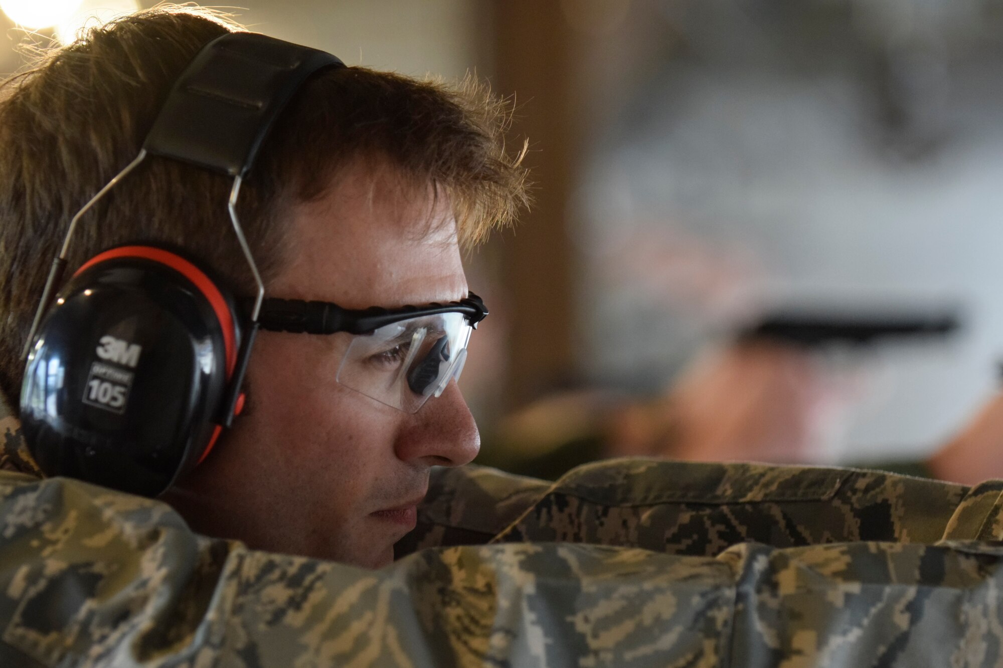 Maj. Matthew Provencher, 752nd Operations Support Squadron assistant director of operations takes aim with an Beretta M-9 pistol at the firing line during the 72nd Security Forces Squadron pistol competition held as part of Police Week 2016 activities on Tuesday May 17, 2016, Tinker Air Force Base, Okla. Provencher was part of the 552nd Air Control Wing's team which took the top shooting team prize. (U.S. Air Force photo/Greg L. Davis)