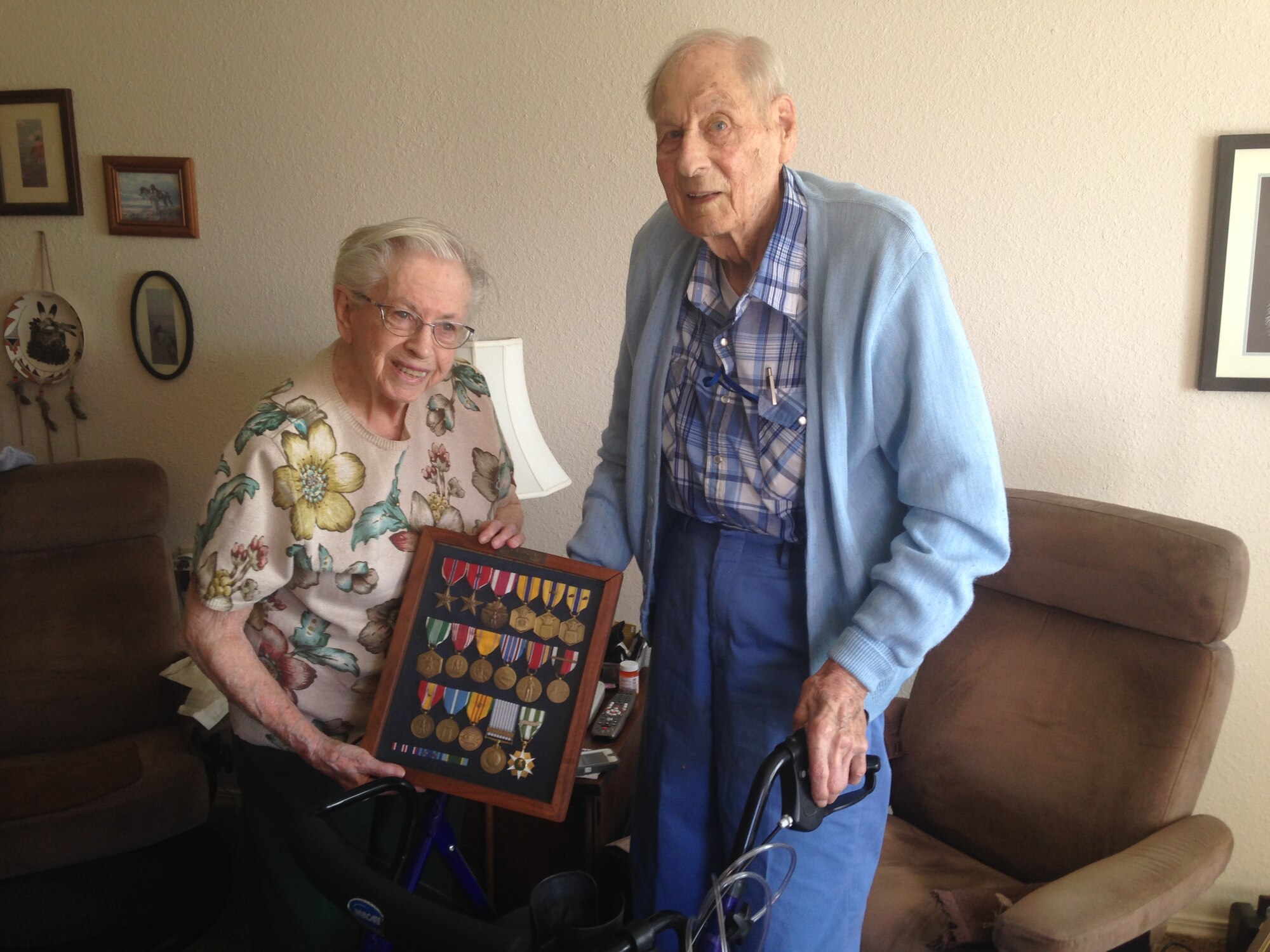 Arnold Ringstead, with his wife Elizabeth, displays medals from 30 years of military service in their Albuquerque home Ringstead was a member of the first cadre assigned to Kirtland Air Force Base. (Photo by Kendahl Johnson)