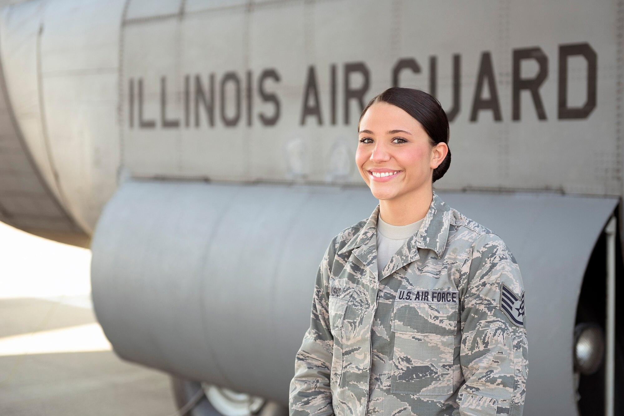 U.S. Air Force Staff Sgt. Rachael L. Blasko, an enlisted accessions recruiter with the 182nd Force Support Squadron, Illinois Air National Guard, stands with one of her unit’s C-130 Hercules aircraft at the 182nd Airlift Wing, Peoria, Ill., May 24, 2016. Blasko is the installation’s newest recruiter and has been serving in the role for two years. (U.S. Air National Guard photo by Staff Sgt. Lealan Buehrer)