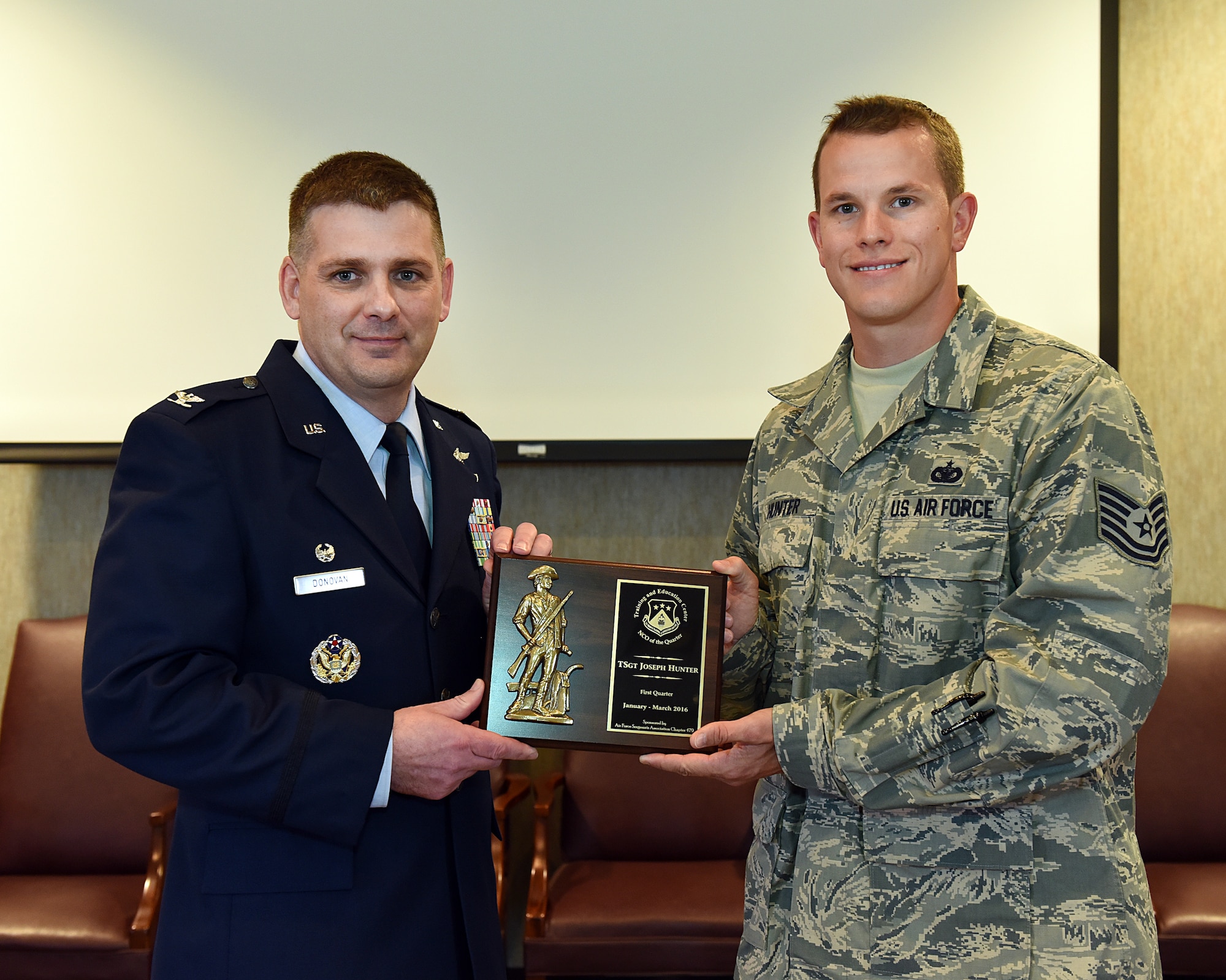 Tech. Sgt. Joseph Hunter is awarded the NCO of the Quarter, June 2, 2016, at the I.G. Brown Training and Education Center in Louisville, Tenn., by Col. Kevin Donovan, commander, during a commander's call. (U.S. Air National Guard photo by Master Sgt. Mike R. Smith/Released)