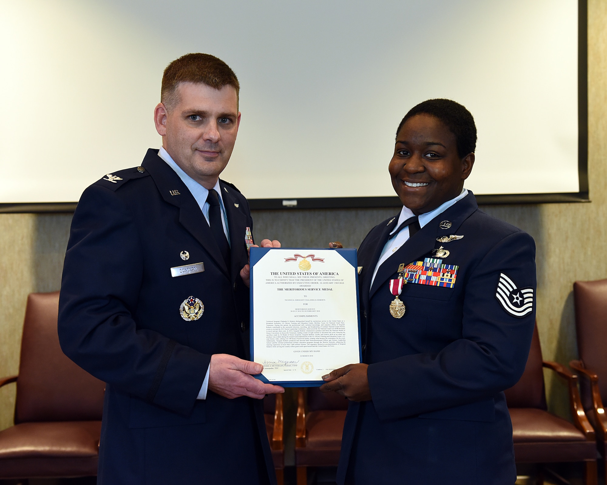 Tech. Sgt. Chalanda D. Roberts is presented the Meritorious Service Medal, June 2, 2016, at the I.G. Brown Training and Education Center in Louisville, Tenn., by Col. Kevin Donovan, commander, during a commander's call. (U.S. Air National Guard photo by Master Sgt. Mike R. Smith/Released)