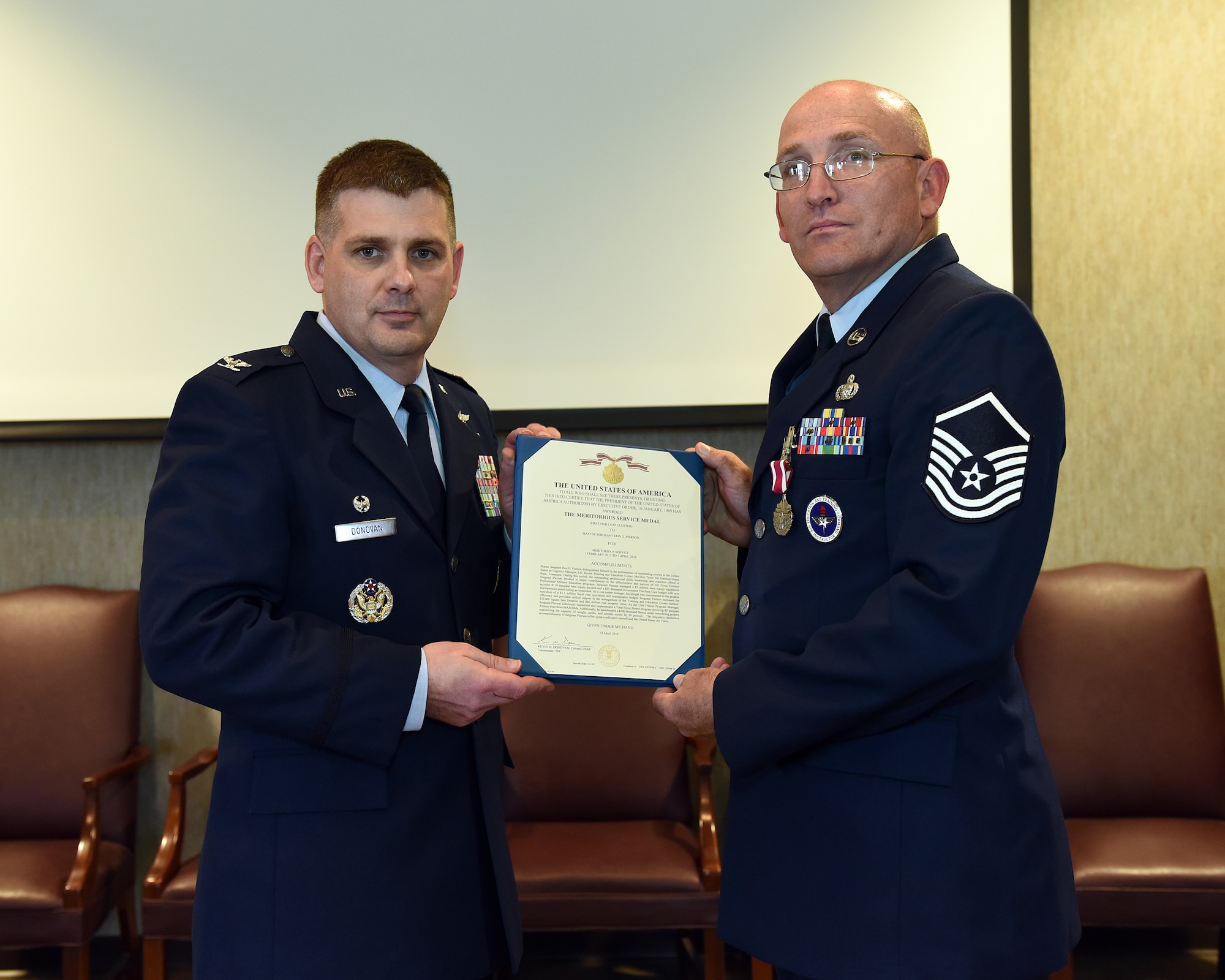 Master Sgt. Don Pierson is awarded the Meritorious Service Medal, June 2, 2016, at the I.G. Brown Training and Education Center in Louisville, Tenn., by Col. Kevin Donovan, commander, during a commander's call. (U.S. Air National Guard photo by Master Sgt. Mike R. Smith/Released)