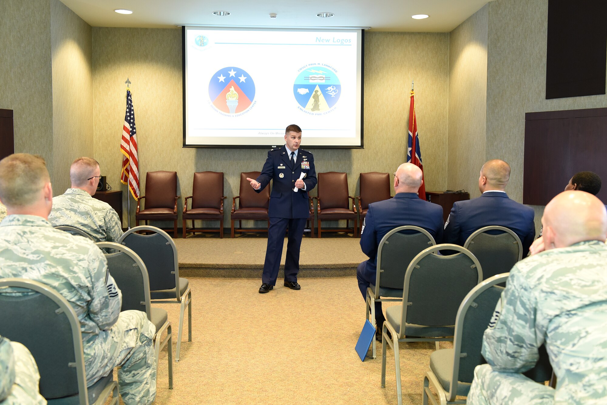 Col. Kevin Donovan, commander, I.G. Brown Training and Education Center in Louisville, Tenn., speaks with his staff about the center's revised official logos, among other topics discussed, June 2, 2016, during a commander's call. About 50 Airmen gathered in the Wingman Hall building. The center holds commander's calls quarterly.(U.S. Air National Guard photo by Master Sgt. Mike R. Smith/Released)