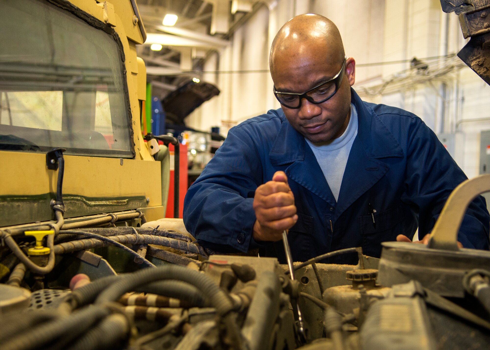 Tech. Sgt. Mortimer Jacobs, 90th Logistics Readiness Squadron Multi-Purpose Vehicle Maintenance Shop NCOIC, inspects a Humvee May 4, 2016 in a LRS building on F.E. Warren Air Force Base, Wyo. Jacobs reviews each vehicle that is sent through the shop and works to streamline the maintenance process while ensuring safe, secure and effective operations. (U.S. Air Force photo by Airman 1st Class Malcolm Mayfield)