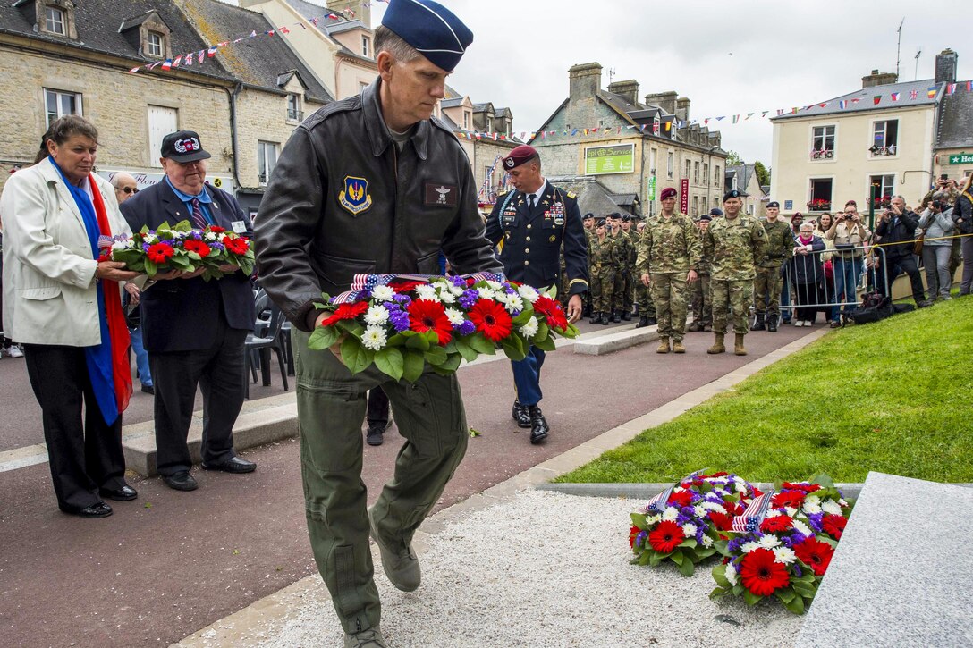 Air Force Lt. Gen. Timothy Ray lays a ceremonial wreath at the Airborne Troops Monument in Sainte Mere Eglise, France, June 2, 2016. More than 380 service members from Europe and affiliated D-Day historical units are participating in the 72nd anniversary of the  event. Ray commands the 3rd Air Force. Navy photo by Petty Officer  1st Class Sean Spratt